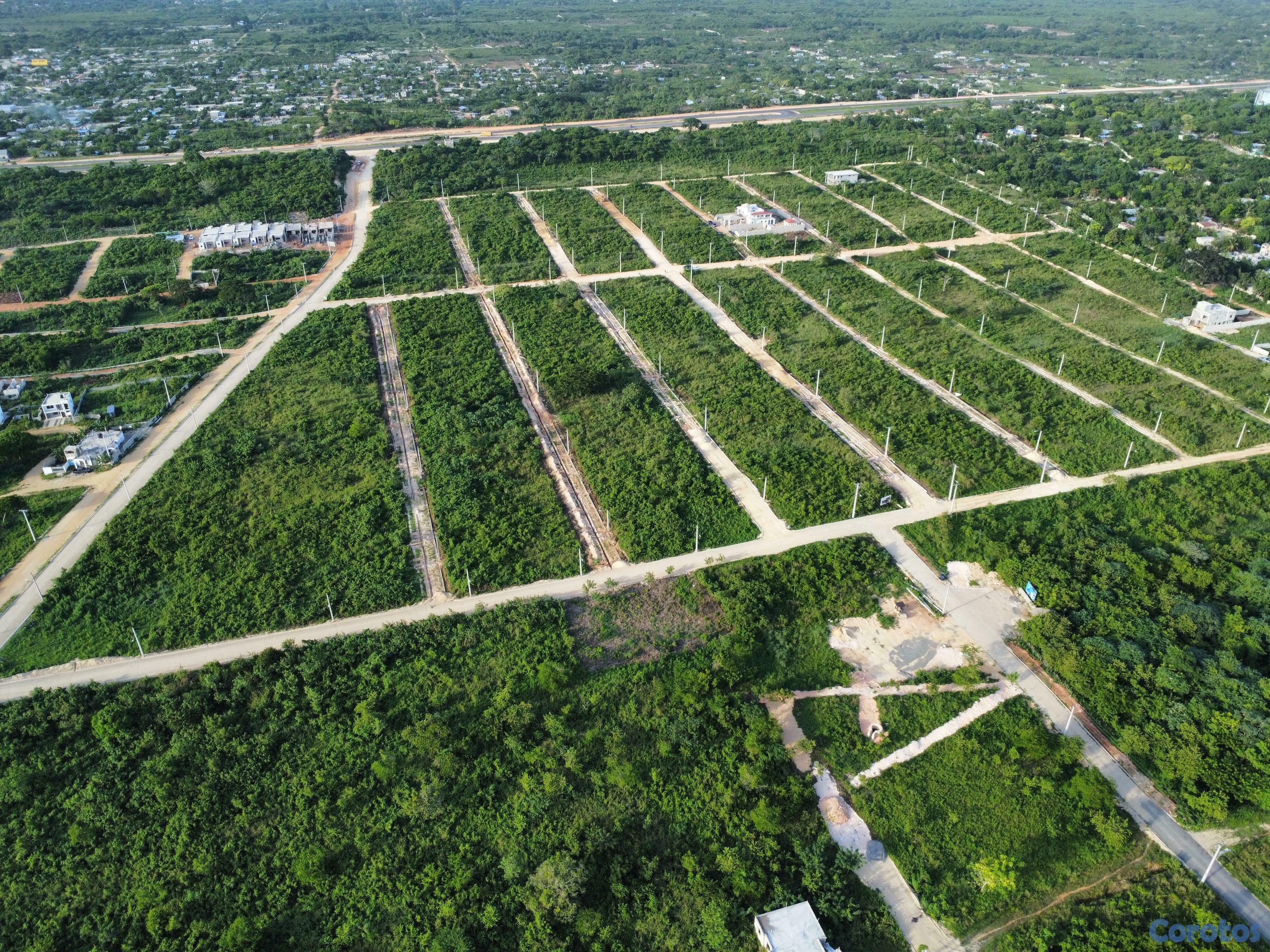 solares y terrenos - Solares financiados en la Avenida Ecológica, con titulo y calles asfaltadas 8